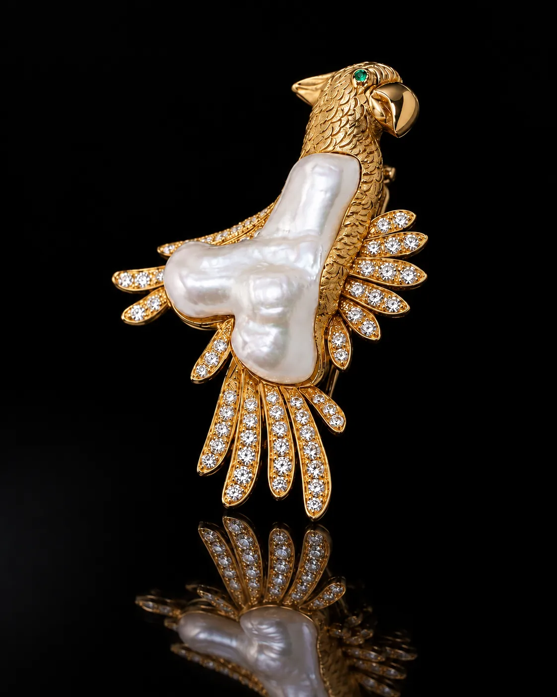 Shahpar, a gold bird brooch with a baroque pearl body and pavé diamond wing